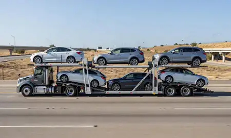 Multi-level car carrier on the highway to California, United States