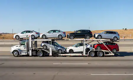 Multi-level car carrier on the highway to Antioch, California, United States