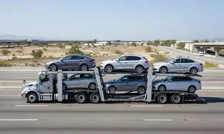 Multi-level car carrier on the highway to Bakersfield, California, United States