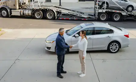 Vehicle owner beside their delivered car in Chula Vista, California, United States