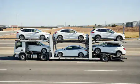Multi-level car carrier on the highway to Concord, California, United States