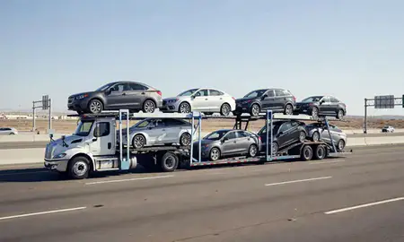 Multi-level car carrier on the highway to Fontana, California, United States
