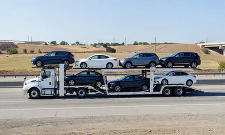Multi-level car carrier on the highway to Fremont, California, United States