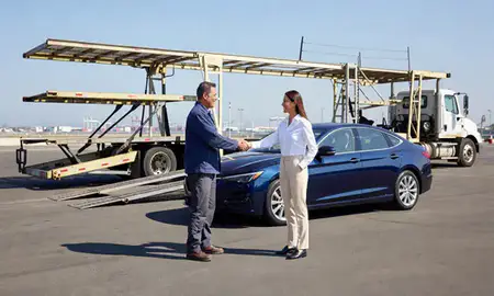 Vehicle owner beside their delivered car in Long Beach, California, United States