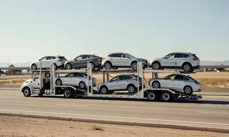 Multi-level car carrier on the highway to Los Angeles, California, United States