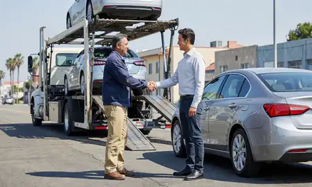 Vehicle owner beside their delivered car in Los Angeles, California, United States