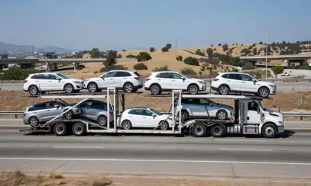 Multi-level car carrier on the highway to Mission Viejo, California, United States