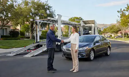 Vehicle owner beside their delivered car in Mission Viejo, California, United States
