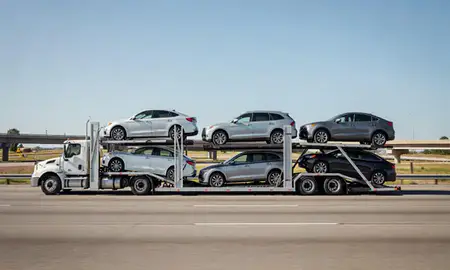 Multi-level car carrier on the highway to Oakland, California, United States