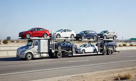 Multi-level car carrier on the highway to Oxnard, California, United States
