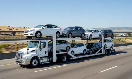 Multi-level car carrier on the highway to San Francisco, California, United States