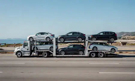 Multi-level car carrier on the highway to Santa Barbara, California, United States