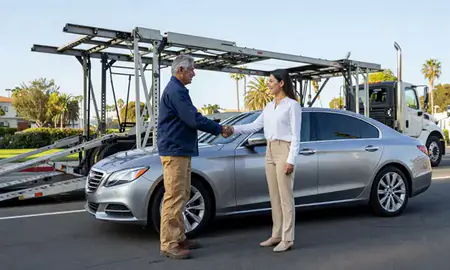 Vehicle owner beside their delivered car in Santa Barbara, California, United States