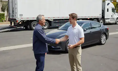 Vehicle owner beside their delivered car in Santa Clarita, California, United States