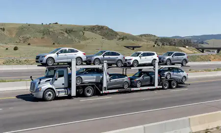 Multi-level car carrier on the highway to Colorado, United States