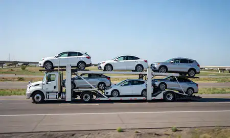 Multi-level car carrier on the highway to Aurora, Colorado, United States