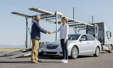 Vehicle owner beside their delivered car in Aurora, Colorado, United States