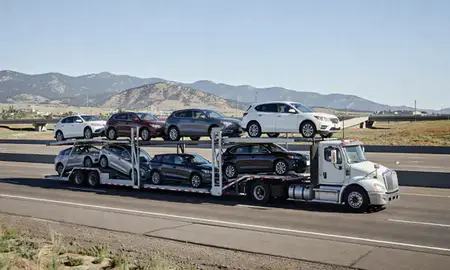 Multi-level car carrier on the highway to Boulder, Colorado, United States
