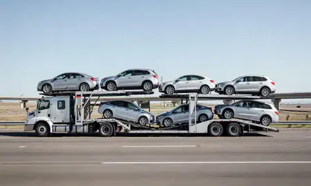Multi-level car carrier on the highway to Brighton, Colorado, United States