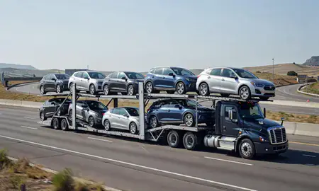 Multi-level car carrier on the highway to Castle Rock, Colorado, United States