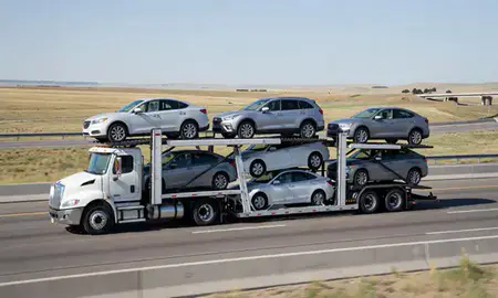 Multi-level car carrier on the highway to Centennial, Colorado, United States