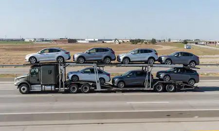Multi-level car carrier on the highway to Commerce City, Colorado, United States