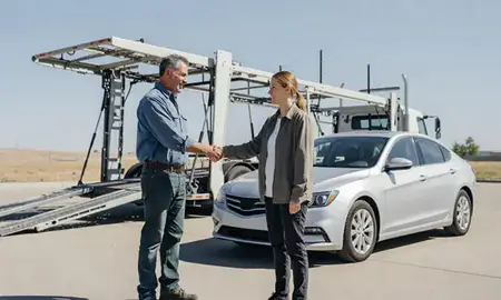 Vehicle owner beside their delivered car in Commerce City, Colorado, United States