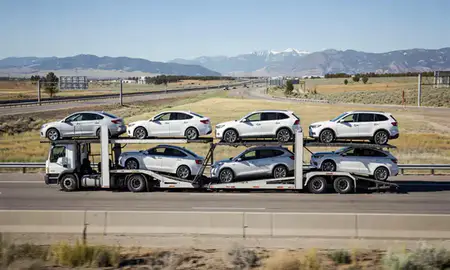 Multi-level car carrier on the highway to Denver, Colorado, United States