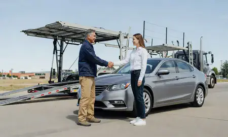 Vehicle owner beside their delivered car in Fort Collins, Colorado, United States