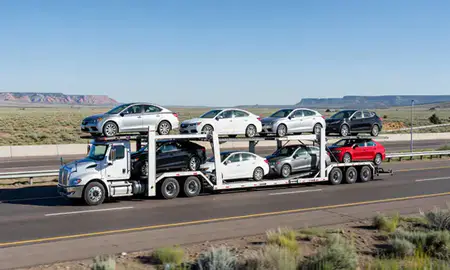 Multi-level car carrier on the highway to Grand Junction, Colorado, United States