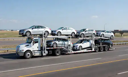 Multi-level car carrier on the highway to Greeley, Colorado, United States