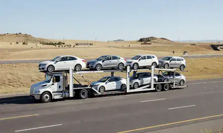 Multi-level car carrier on the highway to Highlands Ranch, Colorado, United States