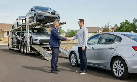 Vehicle owner beside their delivered car in Ken Caryl, Colorado, United States