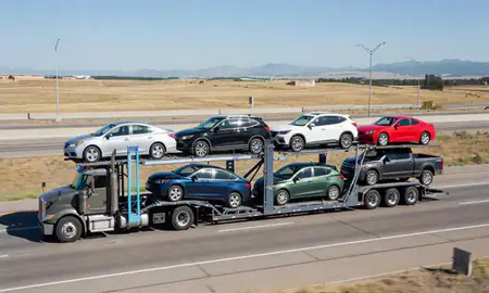 Multi-level car carrier on the highway to Longmont, Colorado, United States