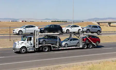 Multi-level car carrier on the highway to Northglenn, Colorado, United States