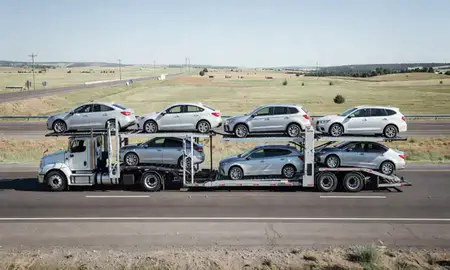 Multi-level car carrier on the highway to Parker, Colorado, United States