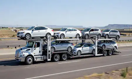 Multi-level car carrier on the highway to Pueblo, Colorado, United States