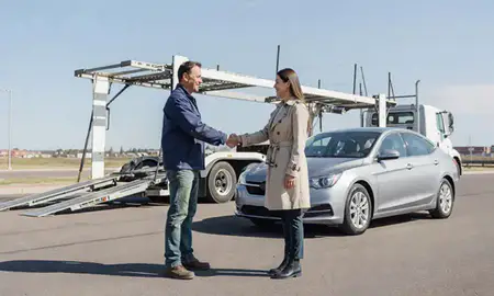 Vehicle owner beside their delivered car in Westminster, Colorado, United States