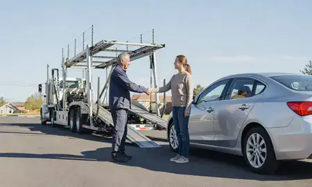 Vehicle owner beside their delivered car in Windsor, Colorado, United States