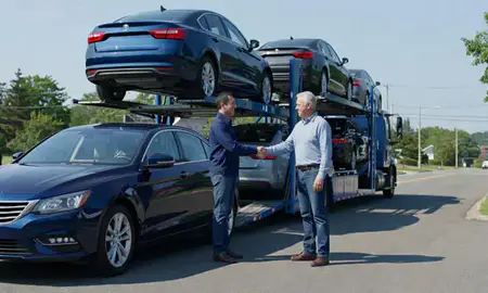 Vehicle owner beside their delivered car in Connecticut, United States