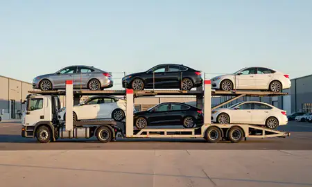 Car transporter parked in an industrial area of Bristol, Connecticut, United States