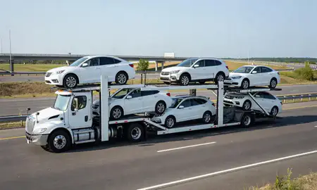 Multi-level car carrier on the highway to Conning Towers Nautilus Park, Connecticut, United States