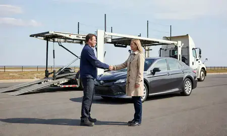 Vehicle owner beside their delivered car in Danbury, Connecticut, United States