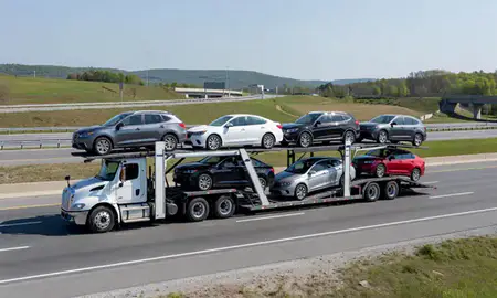 Multi-level car carrier on the highway to Derby, Connecticut, United States