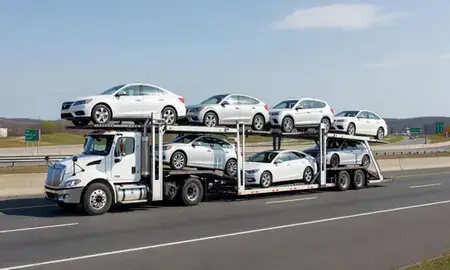 Multi-level car carrier on the highway to Hartford, Connecticut, United States