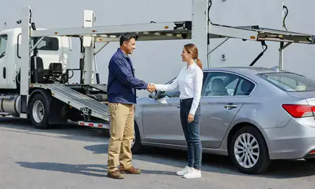 Vehicle owner beside their delivered car in Hartford, Connecticut, United States