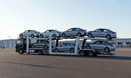 Car transporter loaded with vehicles in Kensington, Connecticut, United States