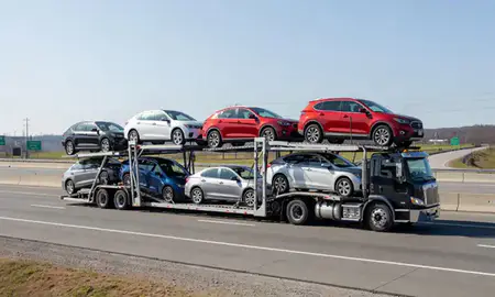 Multi-level car carrier on the highway to Middletown, Connecticut, United States