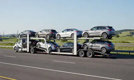 Multi-level car carrier on the highway to New Britain, Connecticut, United States