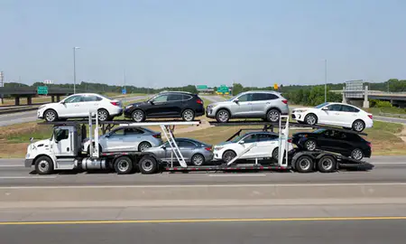 Multi-level car carrier on the highway to New Haven, Connecticut, United States
